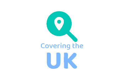 Magnifying glass over UK map with location pin, web design focus.